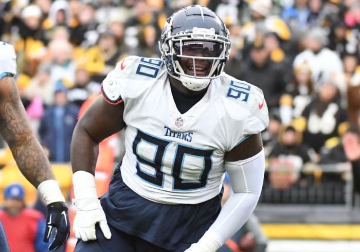 Tennessee Titans defensive tackle Naquan Jones (90) celebrates a sack of Pittsburgh Steelers quarterback Ben Roethlisberger (7) during the first quarter against the Pittsburgh Steelers at Heinz Field.